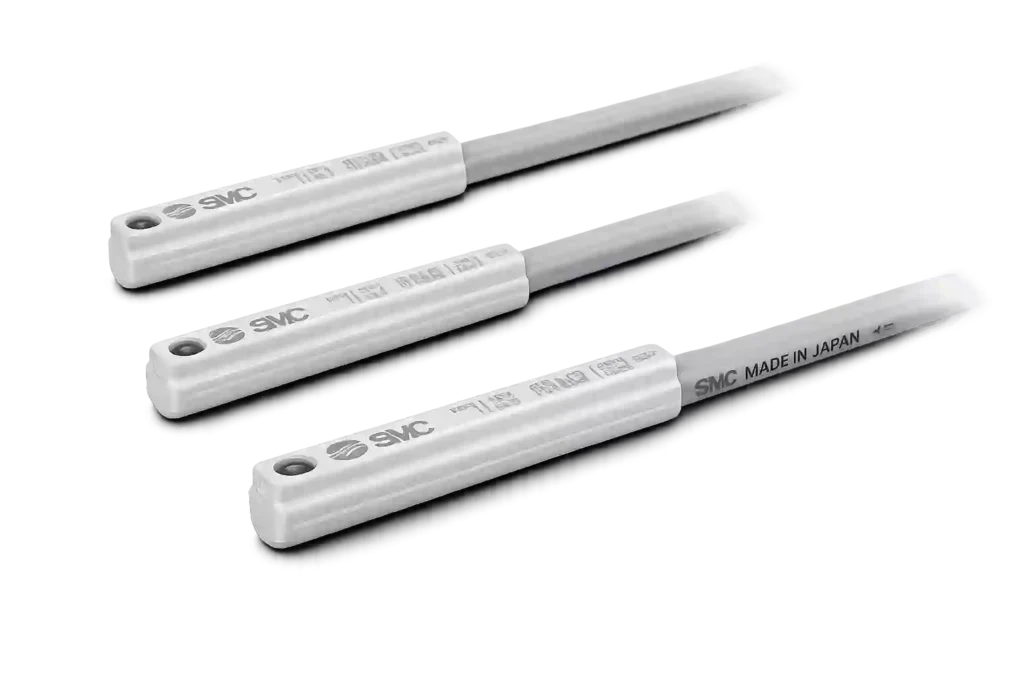 SMC reed sensors for cylinder position detection.